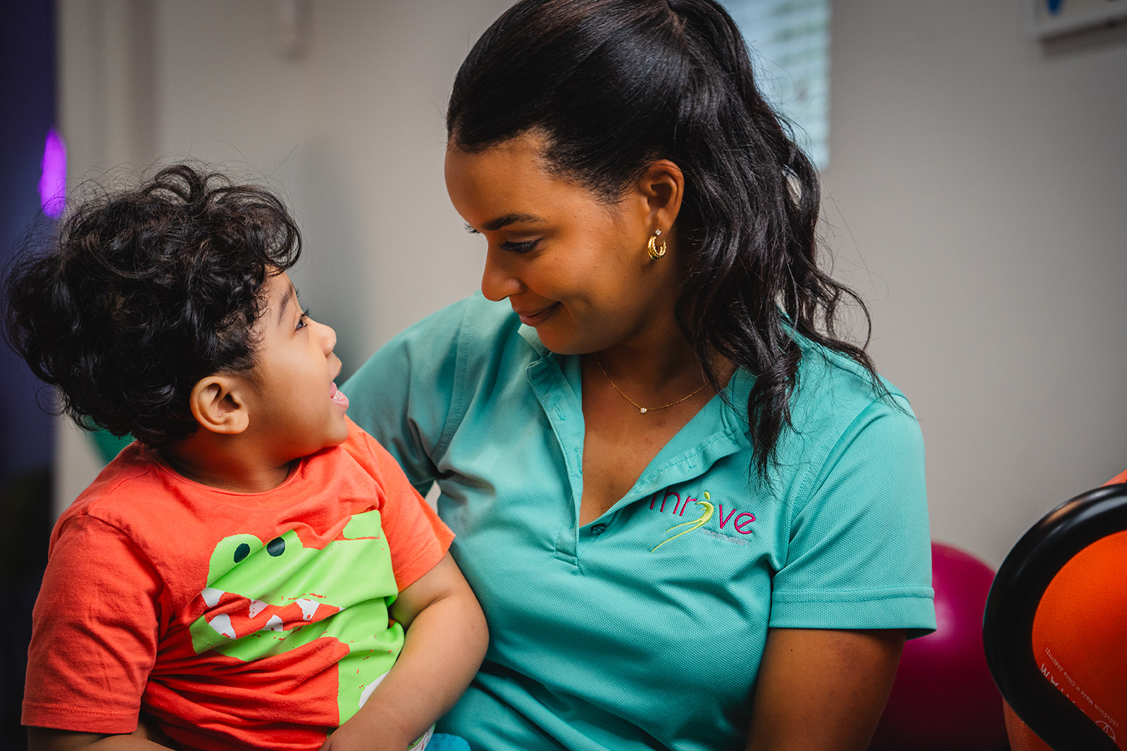 A Thrive therapist sharing a warm moment with a child